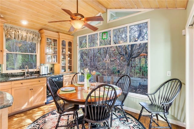 interior space featuring beam ceiling and a sink