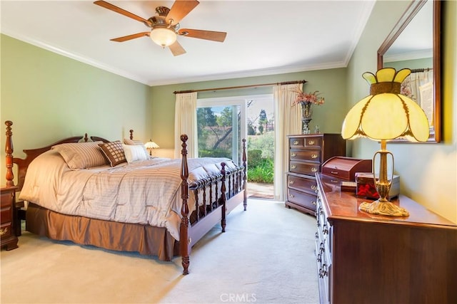 carpeted bedroom featuring access to exterior, crown molding, and a ceiling fan