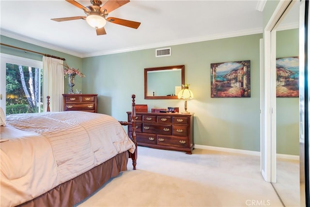 bedroom featuring light carpet, baseboards, visible vents, a ceiling fan, and crown molding