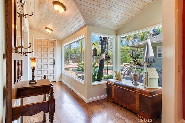 entryway with wood ceiling, lofted ceiling, and wood finished floors