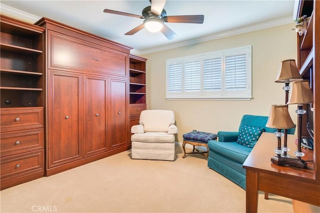 living area featuring carpet flooring, crown molding, and a ceiling fan