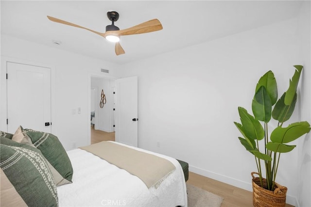 bedroom with ceiling fan and light wood-type flooring