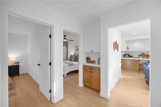 corridor featuring light hardwood / wood-style flooring