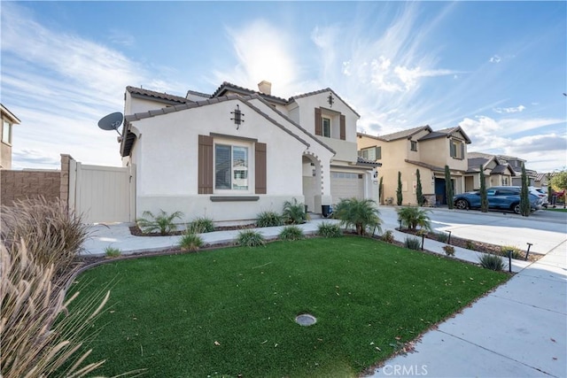 view of front of property with a garage and a front yard