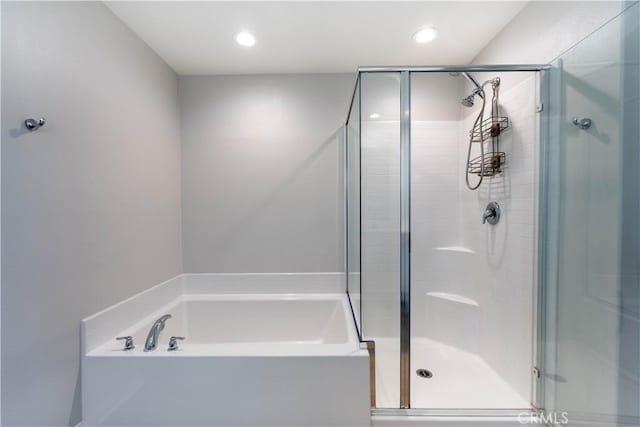 bathroom with separate shower and tub