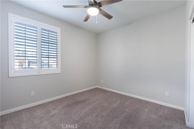 empty room featuring carpet flooring and ceiling fan