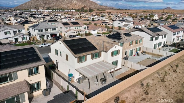 birds eye view of property featuring a mountain view