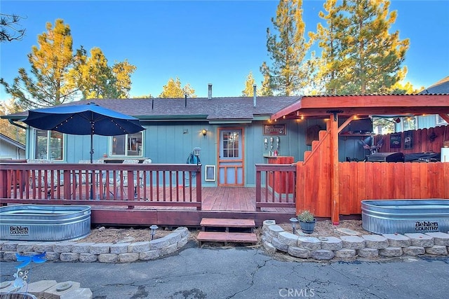back of property with a deck
