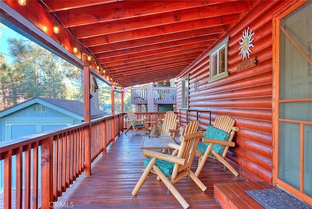 deck with an outdoor structure