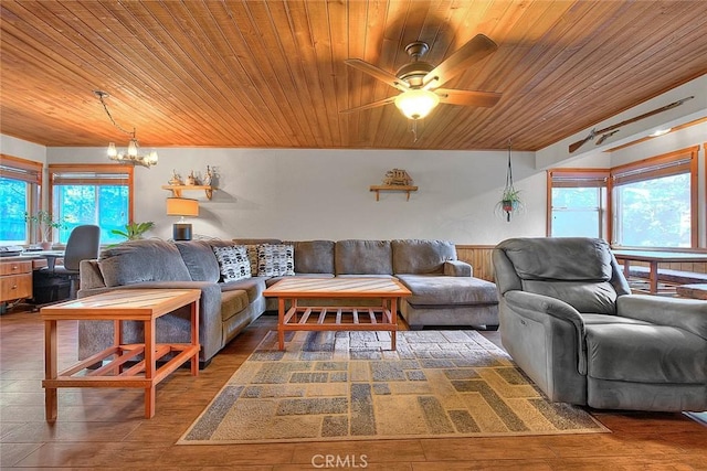 living room with a wealth of natural light, wooden ceiling, and dark hardwood / wood-style floors