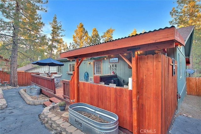rear view of property with fence