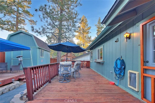 deck with a storage shed