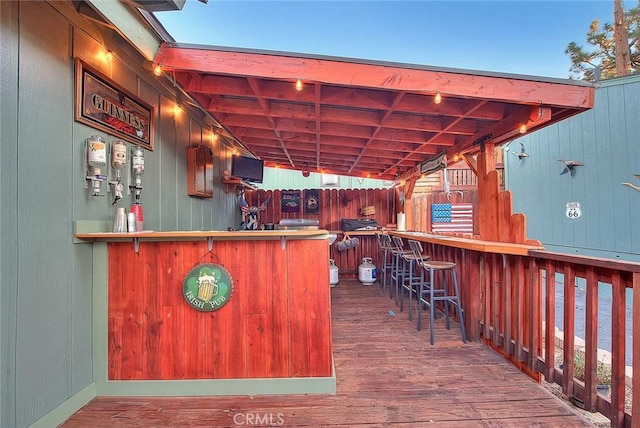 wooden deck featuring outdoor dry bar