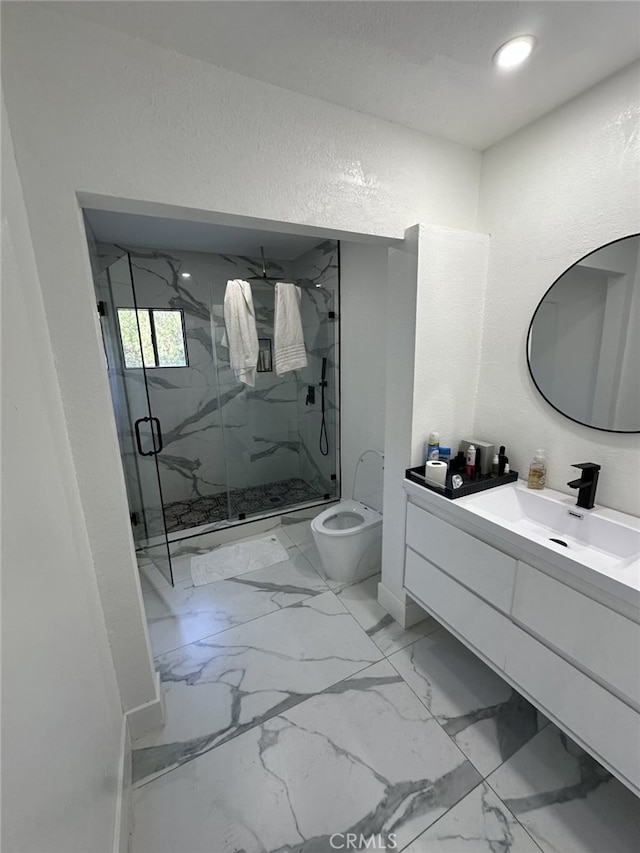 bathroom featuring vanity, toilet, and an enclosed shower