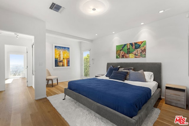 bedroom featuring hardwood / wood-style floors