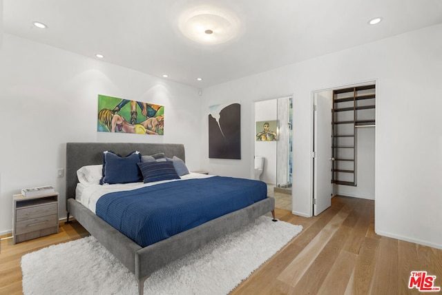 bedroom with light wood-type flooring