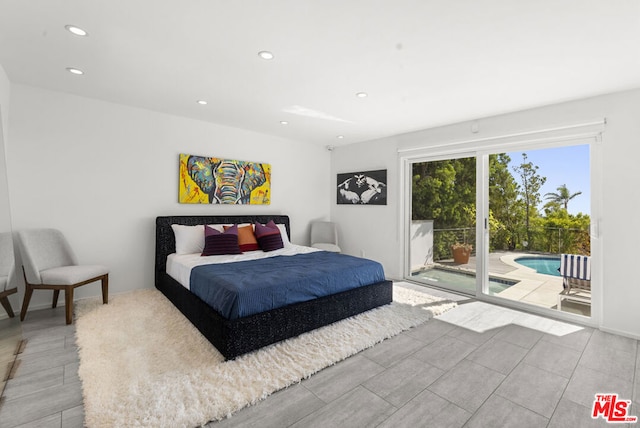 bedroom with access to exterior and light wood-type flooring