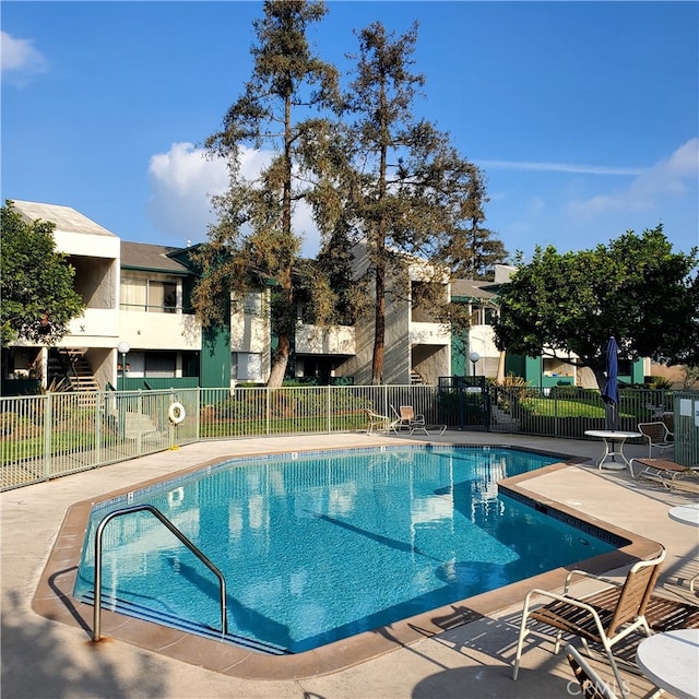 view of pool featuring a patio