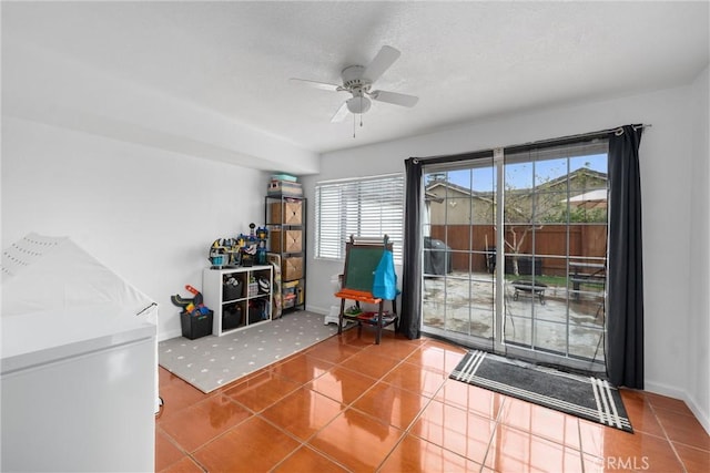 entryway featuring tile patterned flooring and ceiling fan