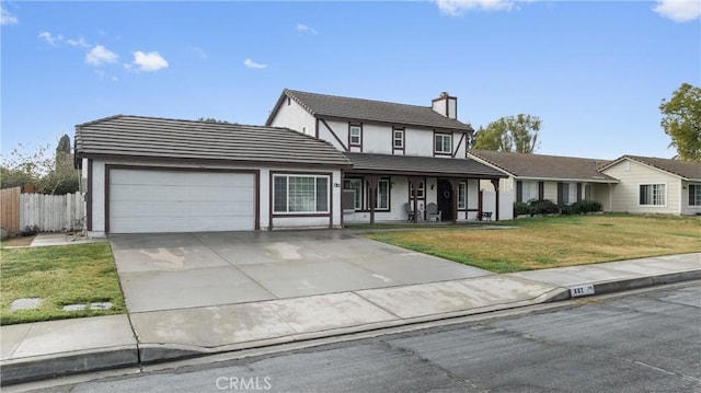 view of front facade with a garage and a front yard