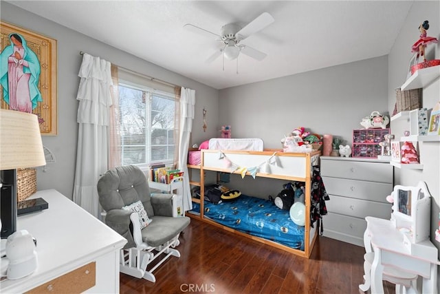 bedroom featuring dark hardwood / wood-style flooring and ceiling fan