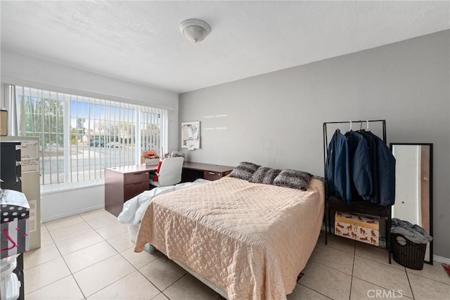 bedroom with light tile patterned floors