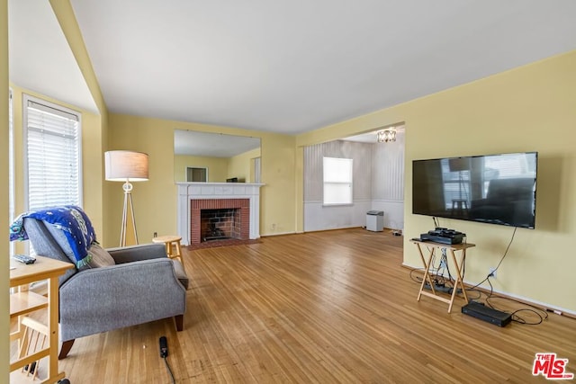 living room featuring hardwood / wood-style flooring and a fireplace