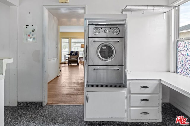 interior space featuring white cabinets, oven, and dark hardwood / wood-style floors