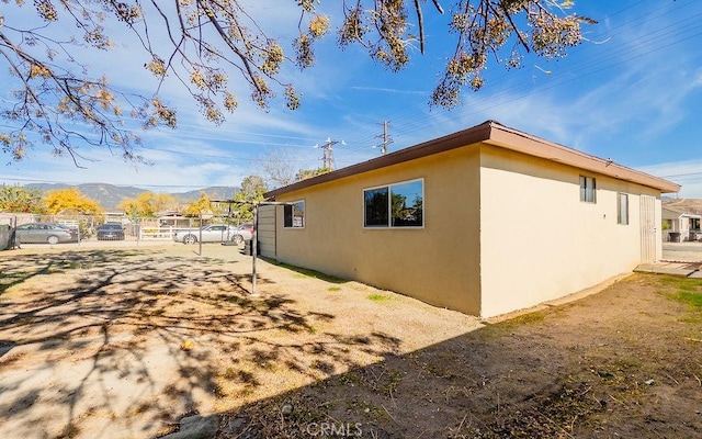 view of home's exterior featuring a mountain view