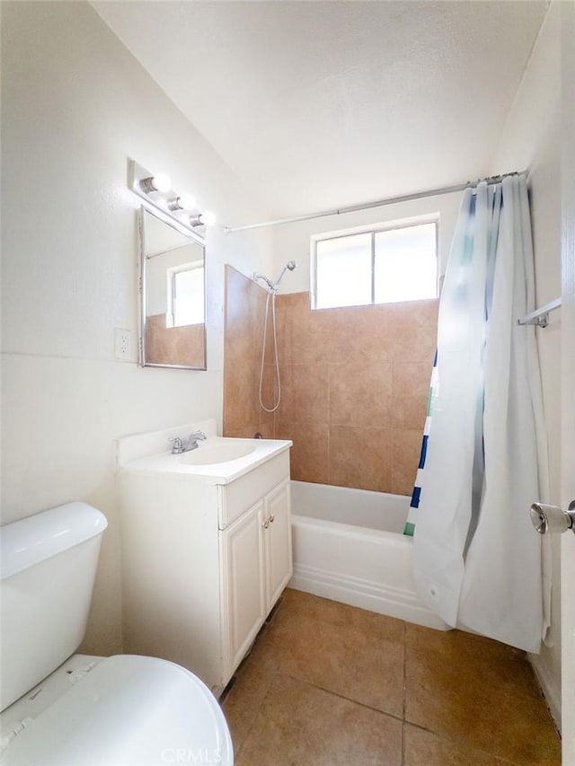 full bathroom with toilet, tile patterned flooring, shower / bath combo, and vanity