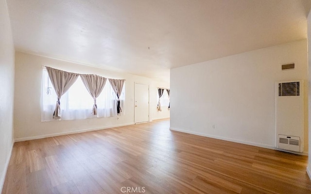 spare room with light wood-type flooring