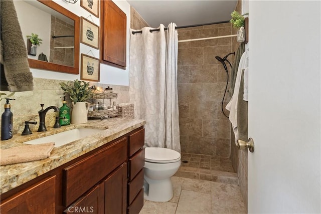 bathroom with vanity, curtained shower, toilet, and tile walls