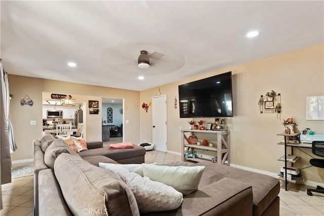 tiled living room featuring ceiling fan