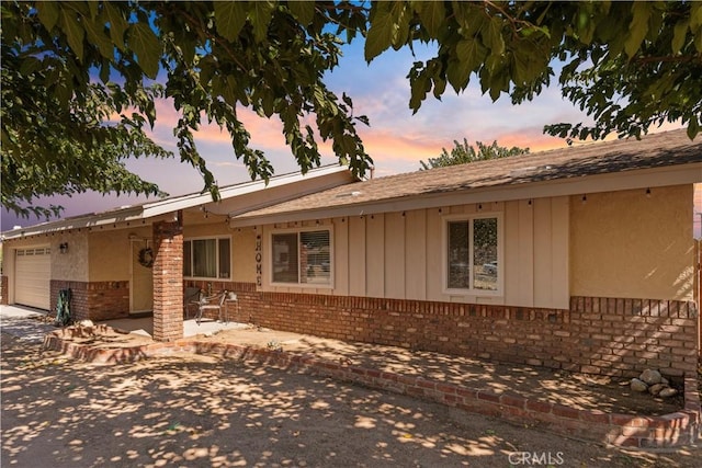 view of front of property with a garage