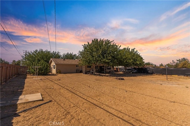 view of yard at dusk