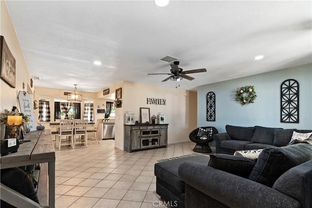 living room with ceiling fan and light tile patterned flooring