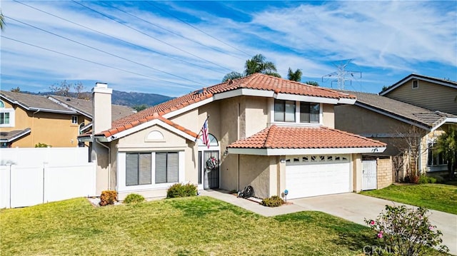 view of front of property with a garage and a front yard