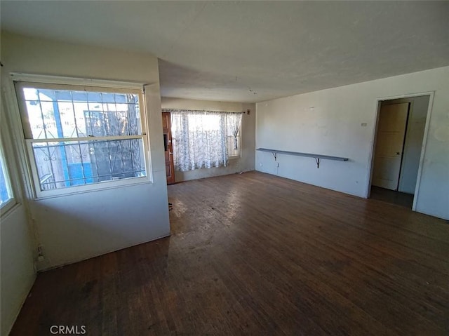 spare room featuring dark hardwood / wood-style flooring