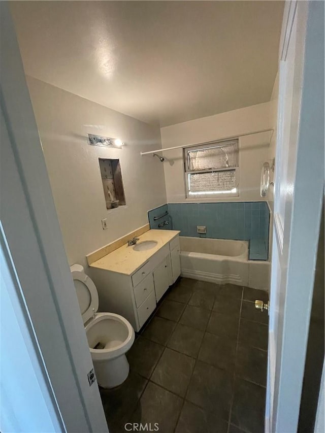 full bathroom with toilet, tile patterned flooring, shower / washtub combination, and vanity