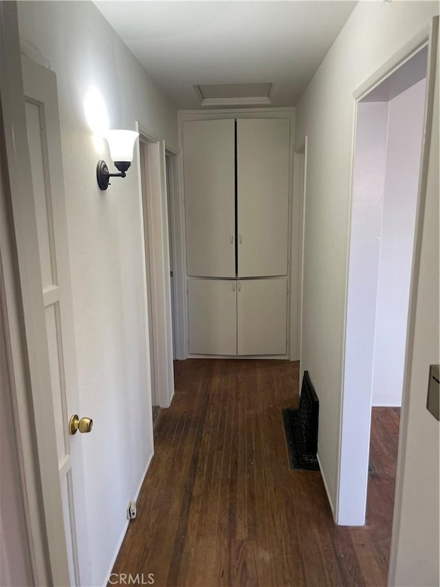 corridor featuring dark wood-type flooring