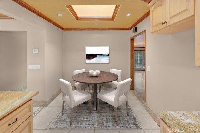 dining room featuring ornamental molding and light tile patterned floors