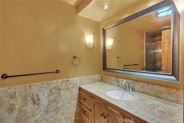 bathroom featuring vanity and walk in shower