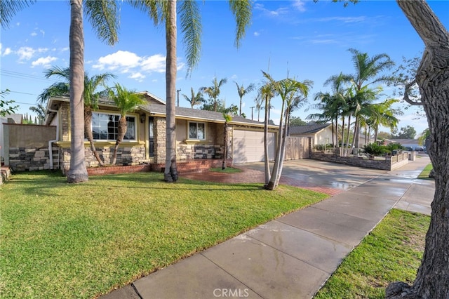 view of front of house with a front yard and a garage