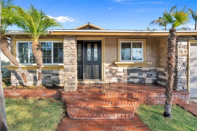 entrance to property featuring covered porch