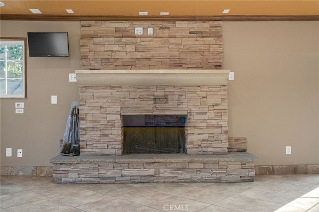 details featuring crown molding and a fireplace