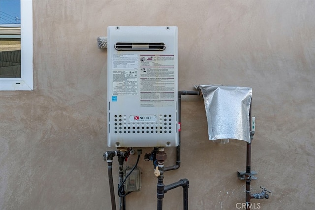 utility room with water heater