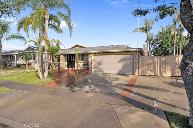 view of front of home with a garage and a front lawn