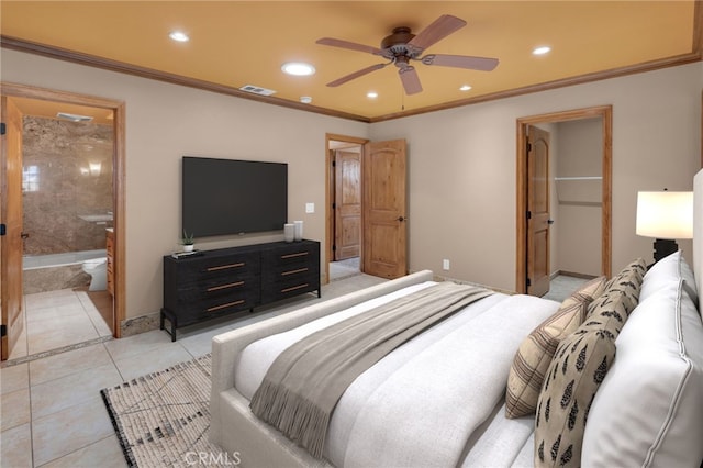 bedroom with ceiling fan, light tile patterned flooring, ornamental molding, and ensuite bath