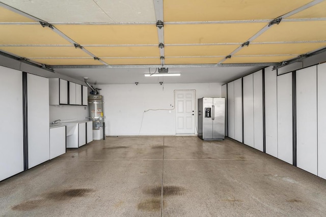 garage with stainless steel fridge with ice dispenser, water heater, and a garage door opener