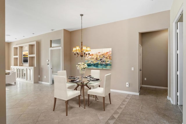 tiled dining area featuring a notable chandelier